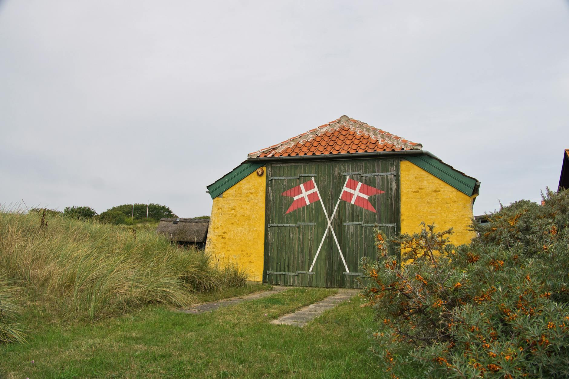 scenic danish barn with decorative flags