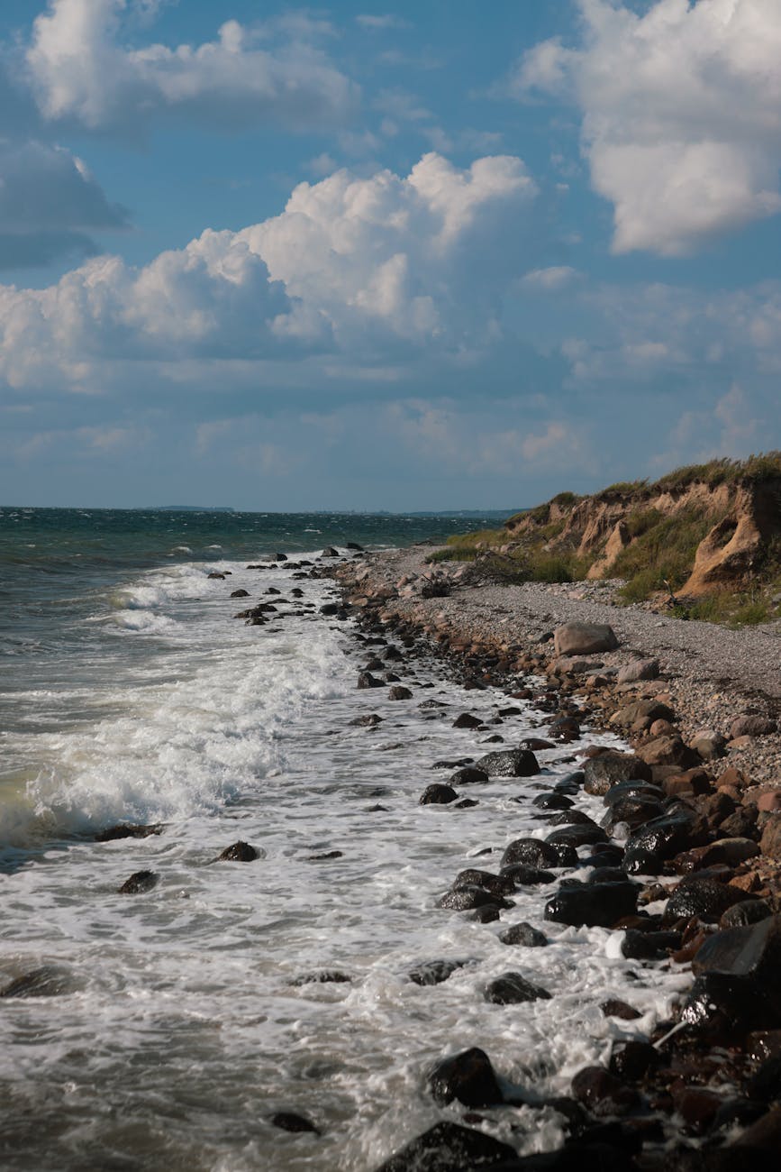 dramatic rocky coastline with crashing waves