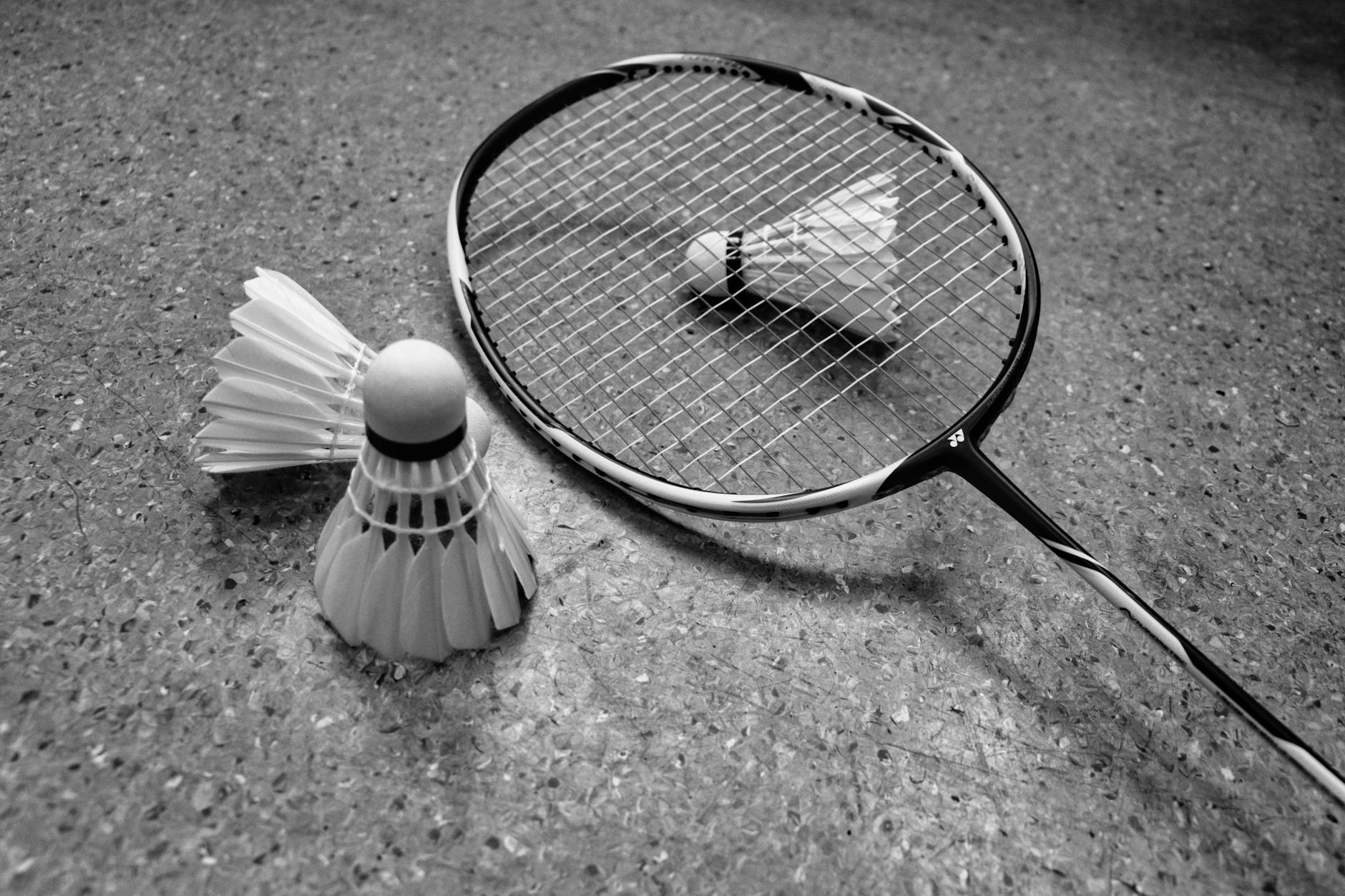 a grayscale photo of a badminton equipment