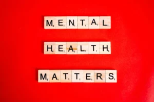 mental health matters spelled on letter tiles on red background
