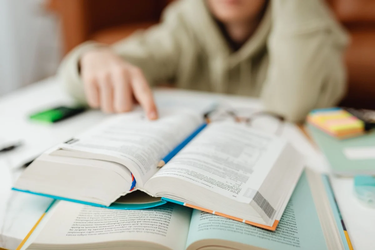 person touching a book